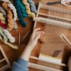 top-view-photo-of-person-weaving-using-hand-loom-4219651